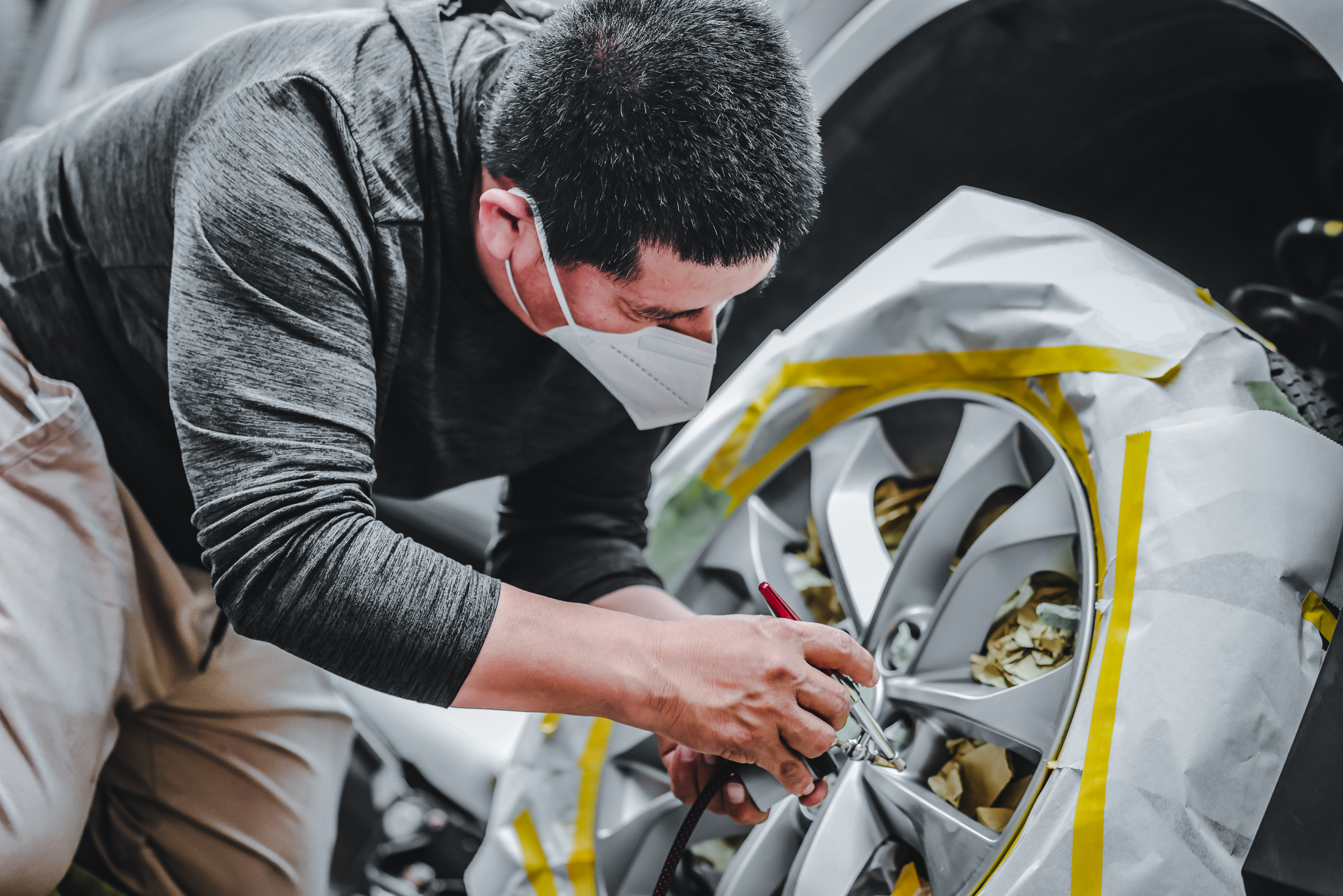 Alloy Wheel Repair Tech masked wheel spraying