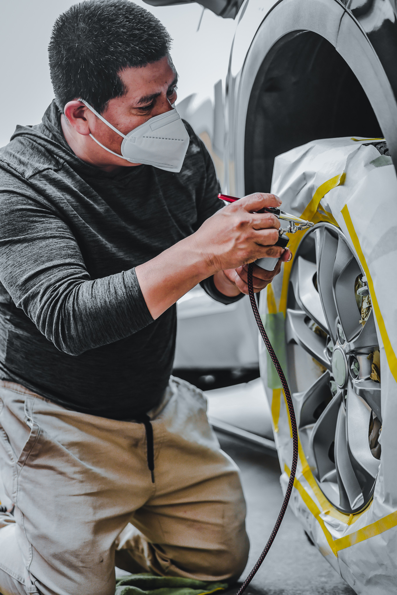 Alloy Wheel Repair Tech masked spraying wheel