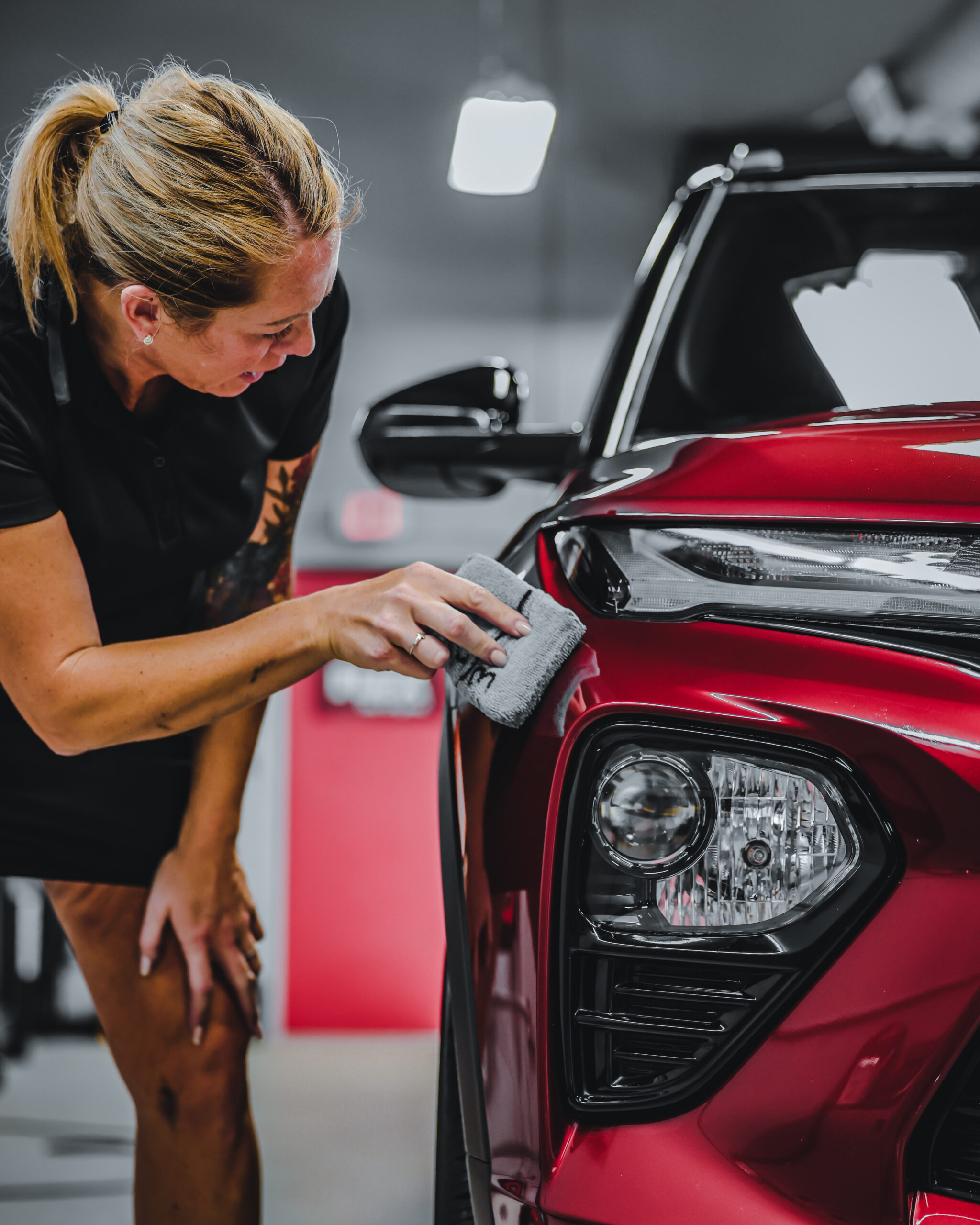 woman performing ceramic coating