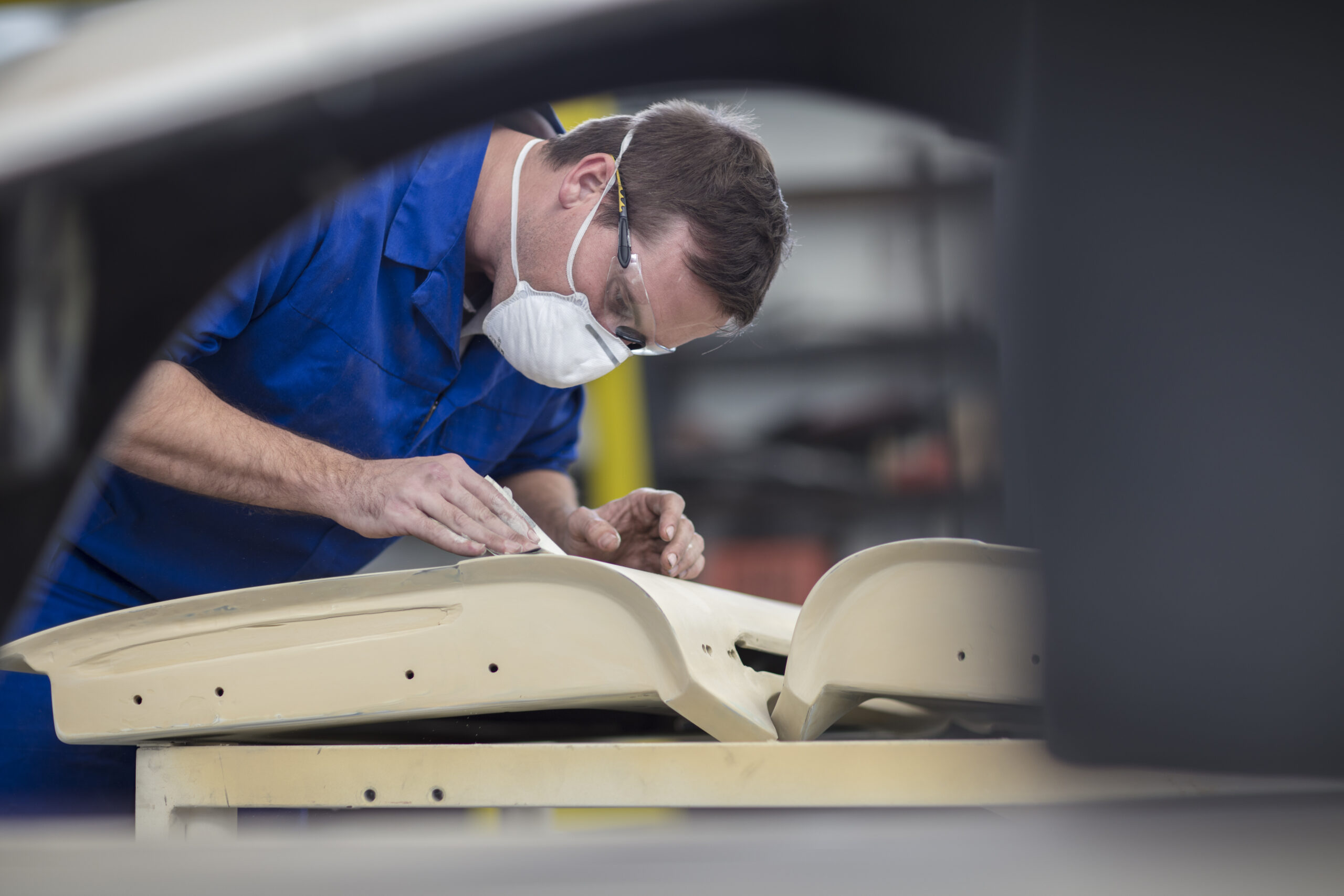 Man performing interior repair on door interior