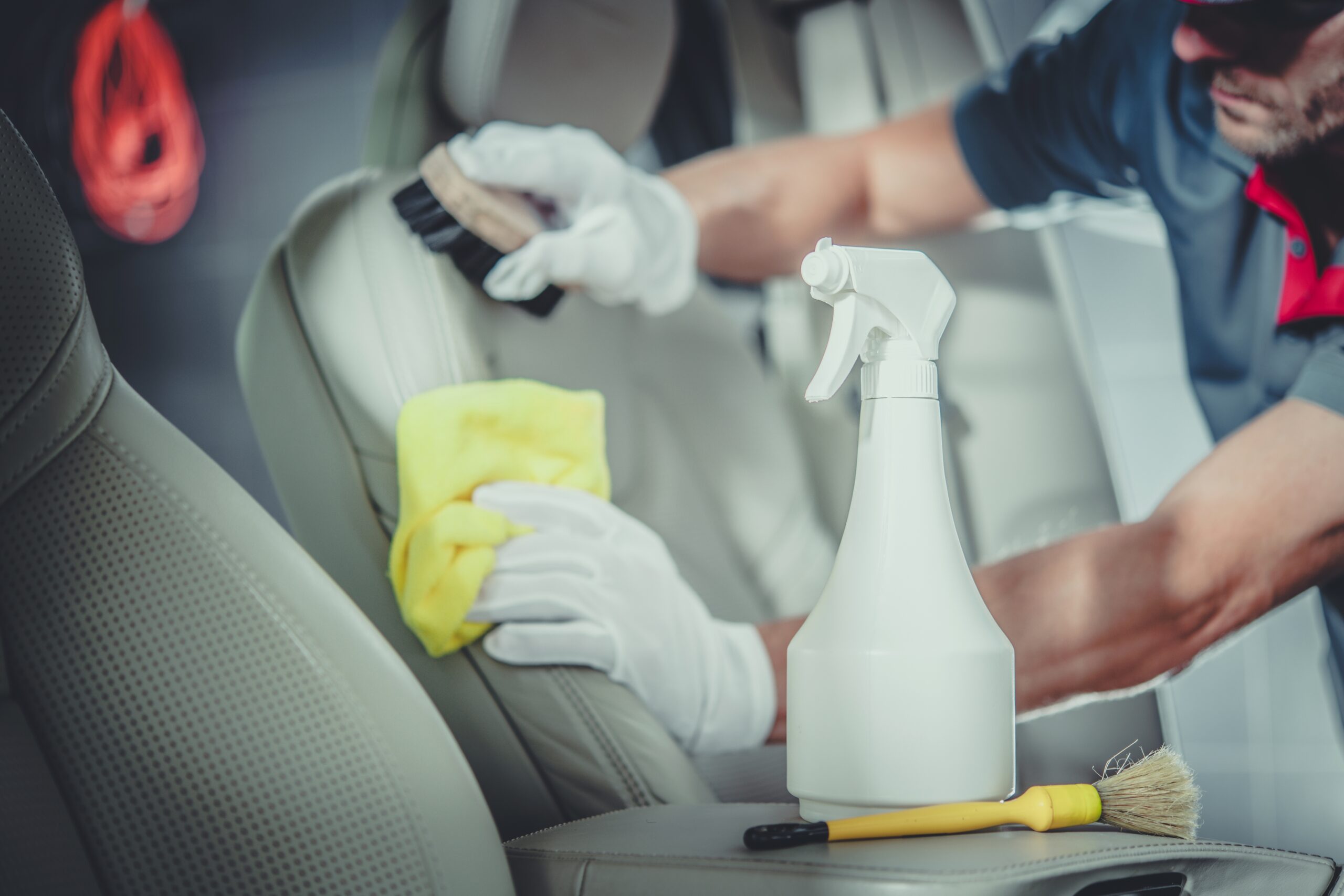 Men Cleaning Car Interior Odor Removal